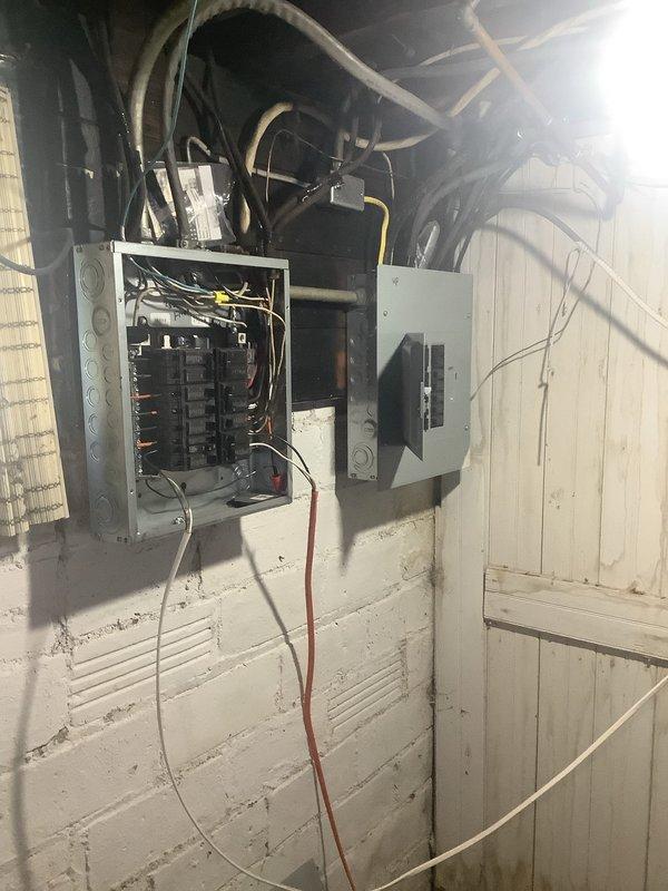 Performed electrical panel inspection and provided estimate for proper grounding installation in main service panel. Assessed existing panel configuration with multiple circuit breakers and identified grounding deficiencies requiring correction to meet current electrical code standards. Documented panel condition and recommended grounding upgrades to ensure safe electrical system operation.