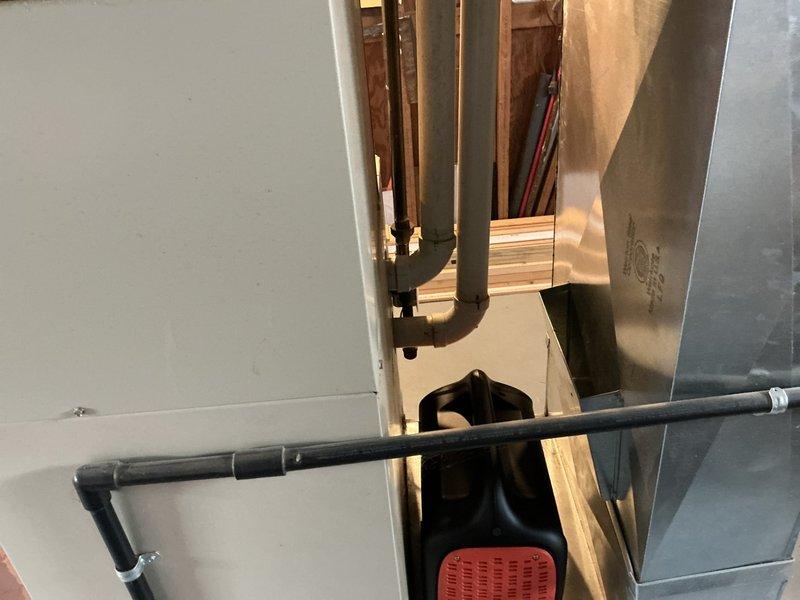 Conducted comprehensive on-site evaluation for complete HVAC system replacement in residential basement location. Assessed existing Carrier heating and cooling equipment configuration, including vertically-stacked furnace and air conditioning components with associated ductwork and ventilation systems. Documented current installation specifications, measured equipment clearances, photographed existing PVC condensate drainage, supply and return ductwork routing, and structural considerations for new system installation. Provided detailed replacement estimate for upgraded HVAC system with proper sizing calculations based on space requirements and existing infrastructure compatibility.