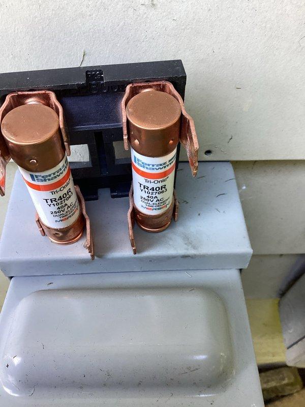 Completed MVP cooling maintenance visit on Lennox outdoor condensing unit. Performed standard system inspection, verified proper operation of all components, and documented equipment condition with photographs showing unit in good working order with clean exterior surfaces and intact electrical disconnect with properly rated TR40R fuses. All safety checks passed and system operating within normal parameters.