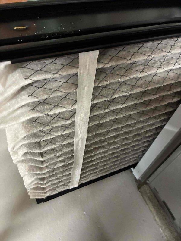 Completed MVP air conditioning maintenance service on residential cooling system. Inspected and verified clean pleated air filter with reinforced mesh construction properly installed in air handler unit. Performed electrical system inspection, checking capacitor, wire connections, and control terminals for proper operation and secure connections.