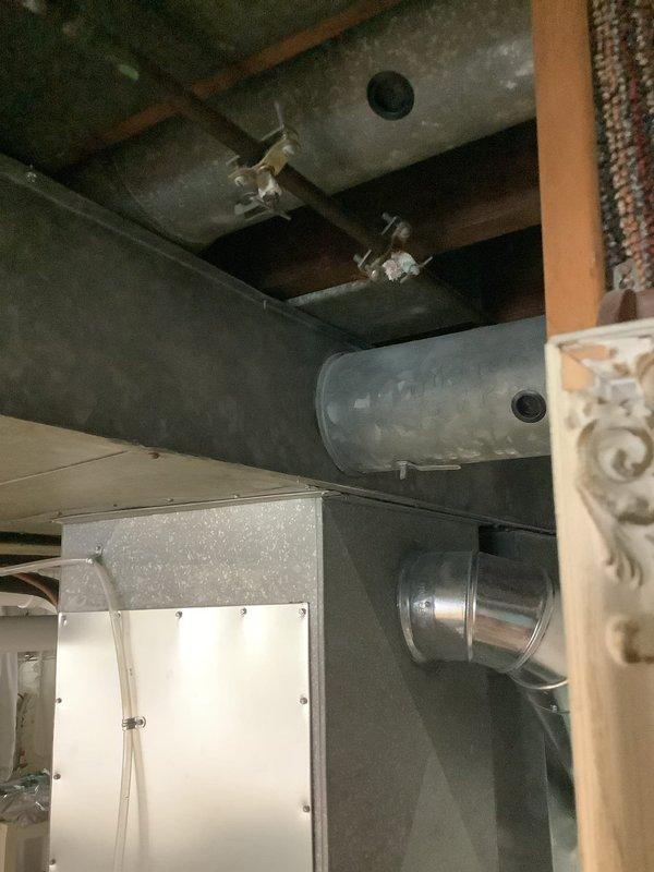 Responded to emergency water leak affecting hot water system. Upon arrival, confirmed hot water supply had been shut off as a precautionary measure to prevent further water damage. Conducted thorough inspection of copper piping loop configuration, expansion tank, and associated plumbing components in utility area. Identified source of leak in hot water distribution system. Assessed solder joints and fittings throughout the copper pipe assembly for integrity. Documented existing mechanical system installation including expansion tank, pressure vessel, and interconnected piping for service records. System evaluated and leak addressed to restore safe operation of hot water supply.