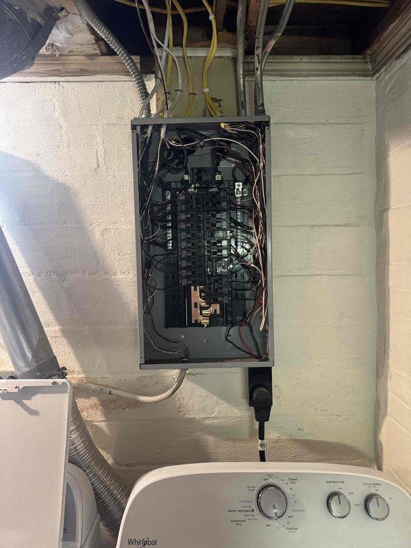 Completed AC circuit installation and power wiring infrastructure upgrade in residential utility space. Installed new circuit breakers in main electrical panel, ran multiple branch circuits through ceiling plenum using appropriate NM cable, and established proper wire management from panel to distribution points. All wiring secured according to code requirements with proper junction box installation in attic space above mechanical room.