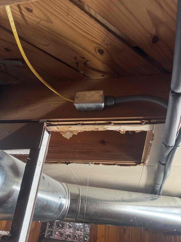 Completed AC circuit installation and power wiring infrastructure upgrade in residential utility space. Installed new circuit breakers in main electrical panel, ran multiple branch circuits through ceiling plenum using appropriate NM cable, and established proper wire management from panel to distribution points. All wiring secured according to code requirements with proper junction box installation in attic space above mechanical room.