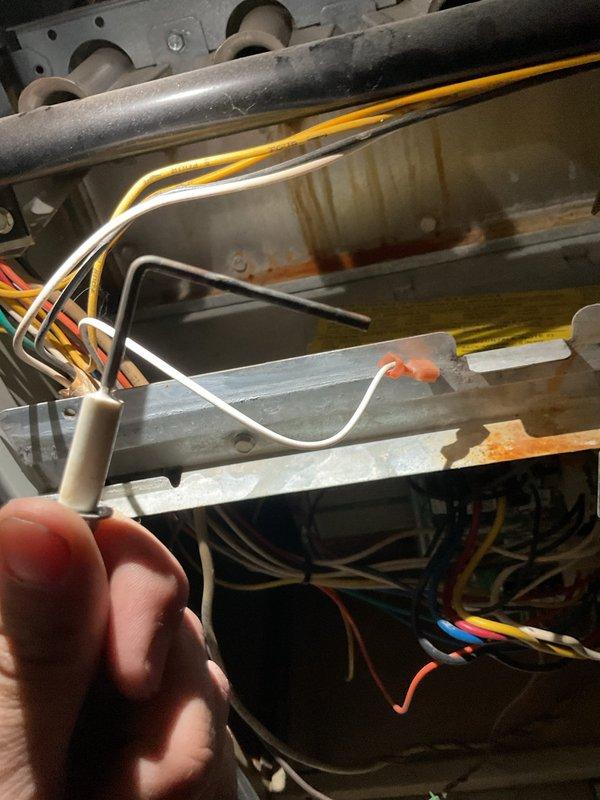 Completed preventive maintenance heating visit on 20-year-old furnace system. Performed comprehensive inspection of heat exchanger, burner assembly, and ignition components. Examined flame sensor, which showed signs of carbon buildup, and cleaned sensor rod to ensure proper flame detection and system operation. Inspected all electrical connections and control wiring throughout the unit. Heat exchanger panels displayed rust staining indicative of age-related condensation exposure, though structural integrity remains intact. Verified proper operation of all safety controls and limit switches. System tested and confirmed operational at time of service completion.