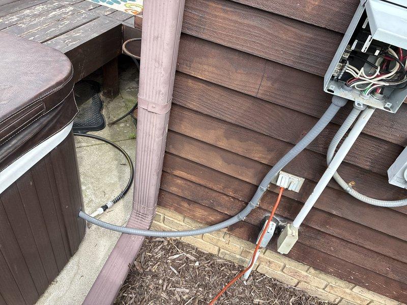 Disconnected electrical service to existing hot tub in preparation for replacement. Safely de-energized the dedicated 240V circuit at the exterior-mounted disconnect box, removed hot tub from power supply while maintaining all existing conduit runs and electrical infrastructure for future reconnection of new unit.