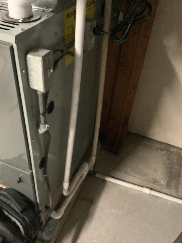Provided estimate for replacement of 27-year-old air conditioning system with new single-stage 3.5-ton unit at single-family residence. Assessed existing HVAC installation located in basement utility area, including furnace/air handler unit with associated condensate drain lines and refrigerant piping. Replacement quote prepared in anticipation of upcoming foundation work requiring temporary removal of equipment, with full system replacement recommended due to age of existing unit.