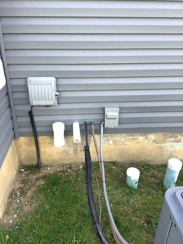 Completed on-site assessment for HVAC system replacement estimate. Evaluated existing Carrier furnace installation in basement utility area, including sheet metal ductwork plenum, PVC condensate drainage system, and associated components. Inspected exterior utility connections including refrigerant line sets with insulation wraps, electrical service panel, and ground-level HVAC piping infrastructure. Documented current system configuration and photographed equipment conditions to provide comprehensive replacement quote for complete heating and cooling system upgrade.