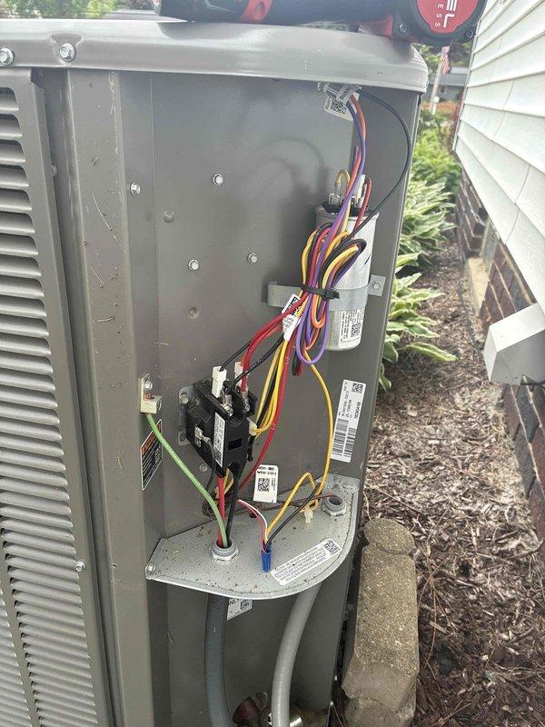 Completed scheduled MVP cooling maintenance visit on 2-year-old Lennox air conditioning system. Performed comprehensive inspection of outdoor condensing unit, including removal of access panel to examine electrical components, wiring connections, capacitors, and relays. All electrical connections found secure with proper color-coded wiring intact. Unit operating within normal parameters with no deficiencies noted during inspection.