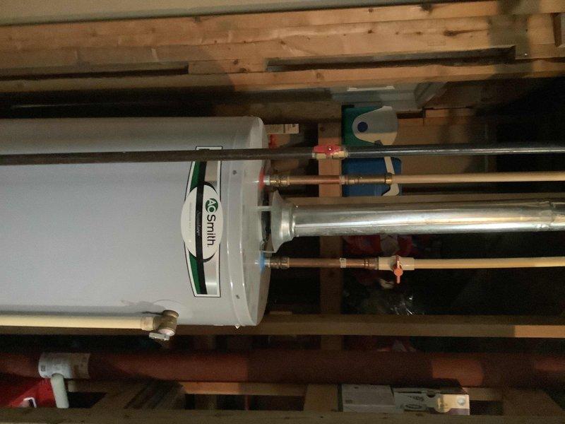 Performed seasonal maintenance and flush service on an A.O. Smith tanked water heater in a residential property. Upon arrival, confirmed the unit was operating properly with no immediate issues noted. Executed complete tank flush procedure to remove sediment buildup, inspected all copper supply lines, brass fittings, and shut-off valves for proper operation and potential leaks. Verified expansion tank mounting and pressure settings, tested temperature and pressure relief valve functionality, and confirmed all connections were secure throughout the system.