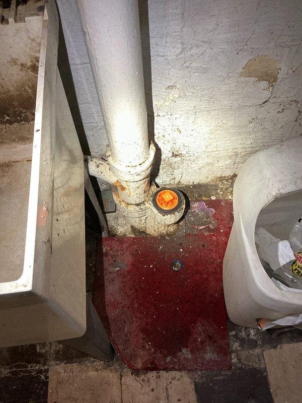 Responded to a main line backup issue causing upstairs sinks and toilets to drain into the basement sink in an 84-year-old home. Upon inspection, located the main cleanout access point in the basement utility area near the water heater and existing plumbing infrastructure. Successfully cleared the blockage in the main drain line, restoring proper drainage flow throughout the residence and eliminating the backup condition.