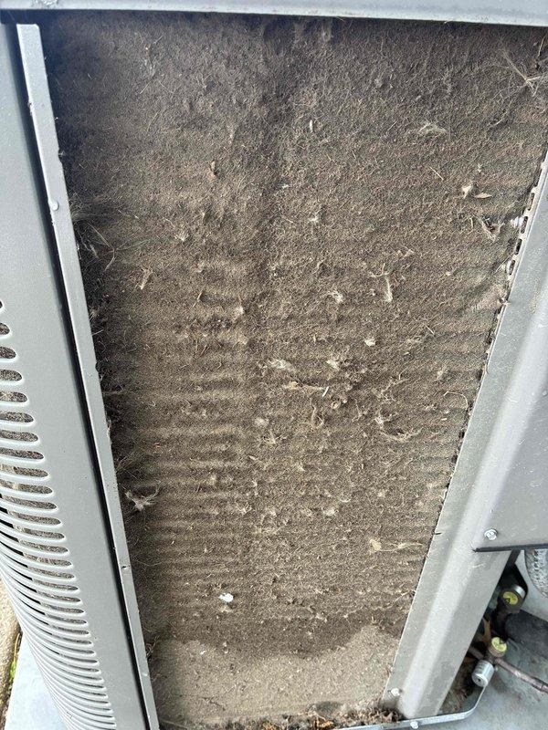 Completed comprehensive tune-up service including chemical wash of evaporator coil due to insufficient cooling on previous visit. The coil exhibited heavy accumulation of dust and debris that was restricting airflow and reducing system efficiency. Applied chemical cleaning solution to thoroughly clean the coil fins and restore proper heat transfer capability, ensuring optimal cooling performance and system operation.