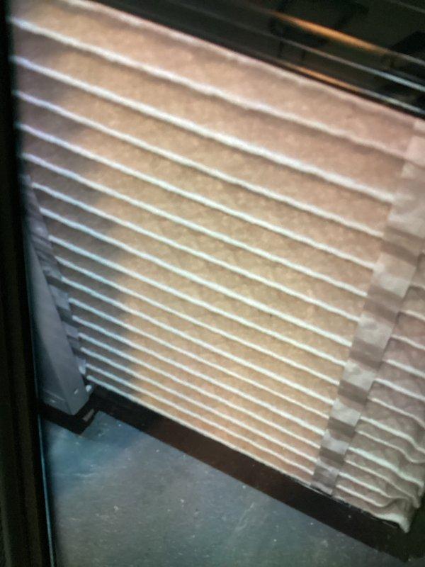 Completed scheduled MVP cooling maintenance visit on residential HVAC system. Performed comprehensive inspection of outdoor condenser unit, noting significant accumulation of dirt, debris, and mineral deposits on coil fins and heat exchanger surfaces. Inspected indoor air handler and documented condition of existing pleated air filter showing normal wear pattern. Unit operational at time of service with all components functioning within normal parameters.