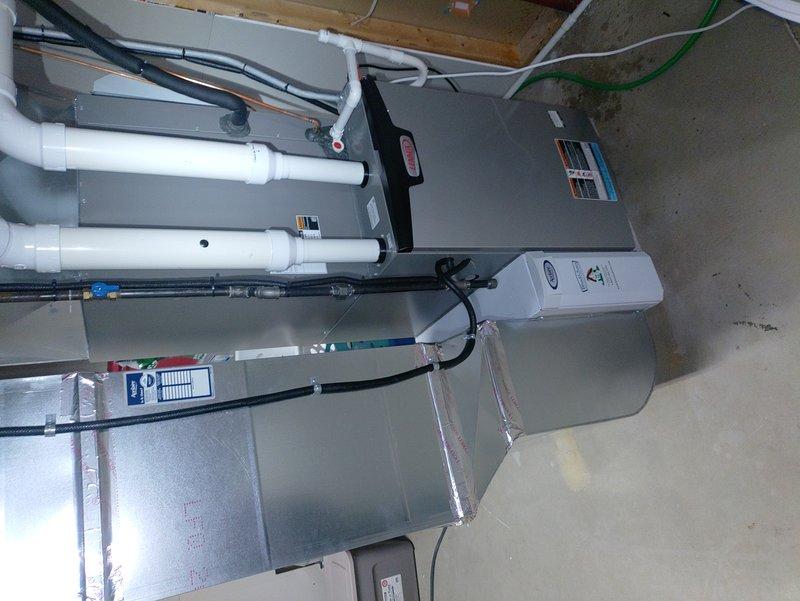 Completed spring maintenance service on two-year-old residential cooling system. Performed comprehensive inspection of air handler unit and condensate management components, including condensate pump with copper tubing connections and electrical wiring verification. Inspected drain pan condition, noting normal weathering consistent with system age, and confirmed proper operation of all drainage components. Verified air handler installation, ductwork connections, PVC condensate lines, and electrical connections throughout system. All components found operating within normal parameters with no immediate service requirements identified.