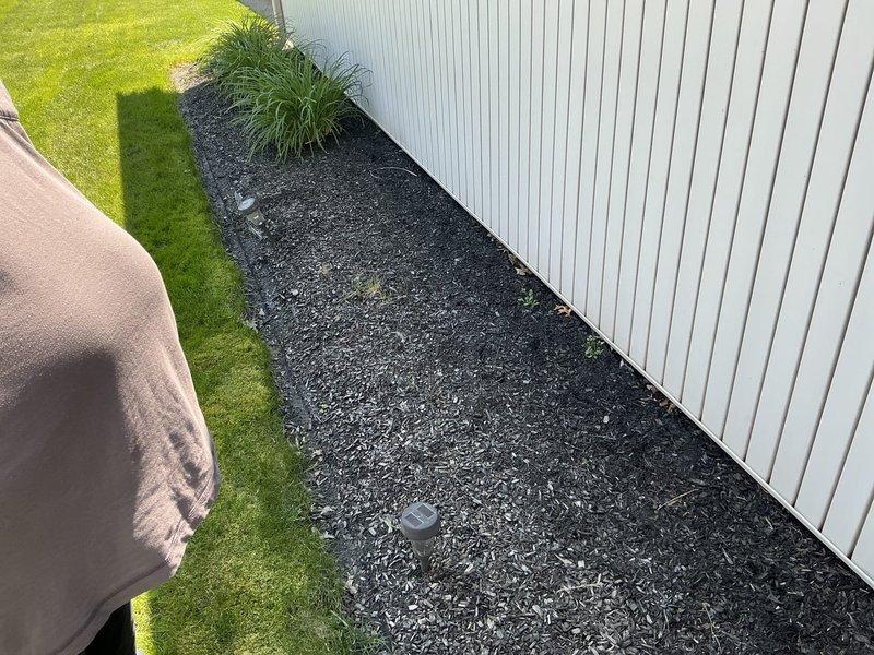 Conducted on-site evaluation for whole home generator installation at residential property. Assessed existing electrical infrastructure, including current HVAC system placement and electrical service panel location. Documented installation area in side yard, noting existing Lennox outdoor unit positioning, available concrete pad space, and proximity to main electrical service. Evaluated clearance requirements, access for gas line connection, and optimal placement for generator unit to meet code compliance and manufacturer specifications. Photographed site conditions including foundation landscaping, utility routing paths, and available installation space to prepare comprehensive electrical estimate for standby generator system.