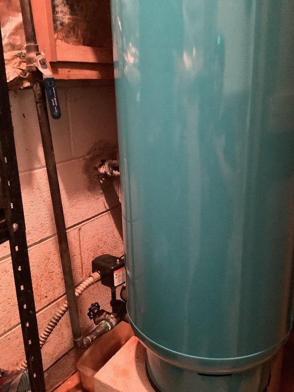 Responded to low water pressure complaint affecting entire home. Previous contractor had replaced pressure tank and installed new pressure switch without resolving the issue. Performed comprehensive assessment of plumbing system including pressure tank, pressure switch, and water distribution lines. Inspected water softener connections and piping throughout basement and crawl space areas. Identified corroded softener line as likely cause of pressure loss based on visual inspection of copper and black piping infrastructure. Documented existing plumbing configuration including water heater connections, supply lines, and pressure regulation components. Customer declined immediate repair authorization.