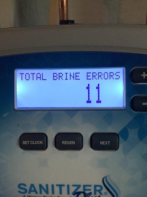 Responded to service call for water quality issues including iron odor and residue in water supply system with 30-gallon well tank and sanitizer softener. Upon inspection, discovered Water-Right Sanitizer Plus system displaying 11 total brine errors on control panel and maximum flow history reading of 49 GPM. Diagnosed system malfunction affecting water treatment performance, documented equipment status through control panel diagnostics, and assessed tee package configuration with well tank setup to address water quality concerns.