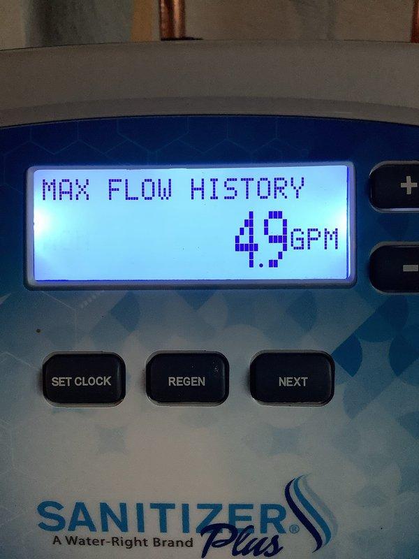 Responded to service call for water quality issues including iron odor and residue in water supply system with 30-gallon well tank and sanitizer softener. Upon inspection, discovered Water-Right Sanitizer Plus system displaying 11 total brine errors on control panel and maximum flow history reading of 49 GPM. Diagnosed system malfunction affecting water treatment performance, documented equipment status through control panel diagnostics, and assessed tee package configuration with well tank setup to address water quality concerns.