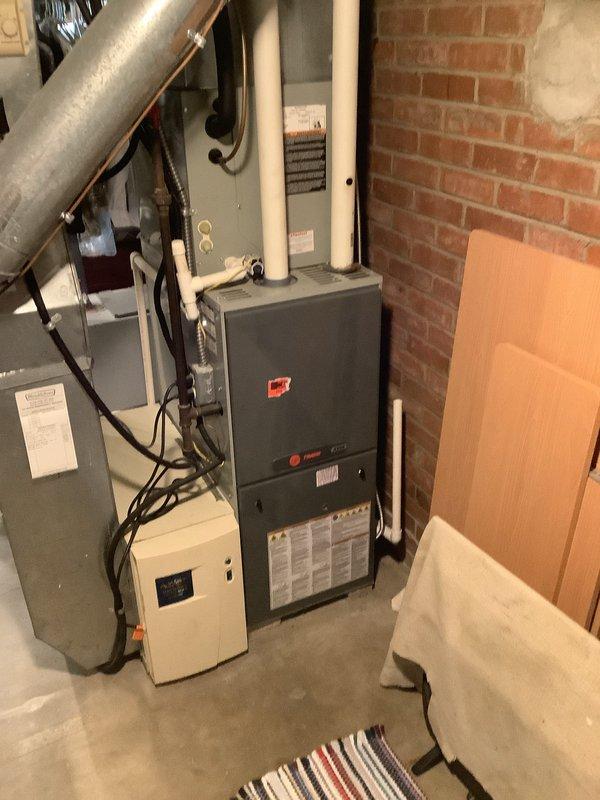 Completed installation of 90% efficiency furnace with S40 thermostat and Smart Room Sensor 2410. Reconnected existing dehumidifier and humidifier units to new system, ensuring proper electrical and plumbing integration. Performed comprehensive ductwork repairs throughout basement, applying mastic sealant to all exposed seams and joints to eliminate air leakage and improve system efficiency. All equipment tested and confirmed operational upon completion.