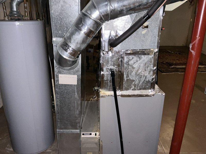 Conducted comprehensive assessment of existing HVAC system for replacement estimate, including 3-year-old furnace and 30-year-old air conditioning unit. Evaluated current equipment condition, ductwork configuration, and mechanical room layout to determine optimal replacement specifications. Documented existing system components including air handler, metallic ductwork with humidifier attachment, and overall installation accessibility for future equipment upgrade planning.