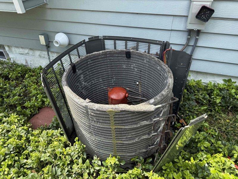 Performed visual inspection of outdoor condensing unit as part of refrigerant leak search service. Thoroughly examined coil assembly, refrigerant lines, and all accessible components but found no visible signs of refrigerant leakage at this time. Due to ambient temperature conditions being below the 70-degree threshold required for accurate leak detection, full leak search procedure was postponed and will need to be rescheduled for warmer weather to ensure proper system pressures and reliable leak detection results.