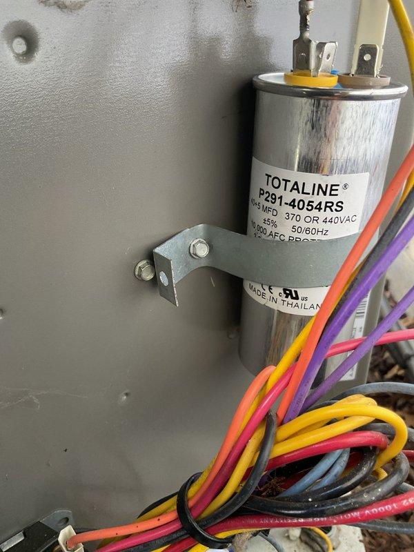 Diagnosed Lennox outdoor condensing unit with failed dual capacitor reading 0 microfarads on compressor side, causing compressor motor to draw excessive amperage. Replaced defective dual capacitor with new Totaline P291-4054RS rated for 370/440VAC to restore proper compressor operation and prevent potential compressor damage. System tested and operating within normal parameters.