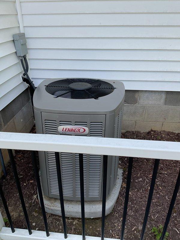 Diagnosed Lennox outdoor condensing unit with failed dual capacitor reading 0 microfarads on compressor side, causing compressor motor to draw excessive amperage. Replaced defective dual capacitor with new Totaline P291-4054RS rated for 370/440VAC to restore proper compressor operation and prevent potential compressor damage. System tested and operating within normal parameters.