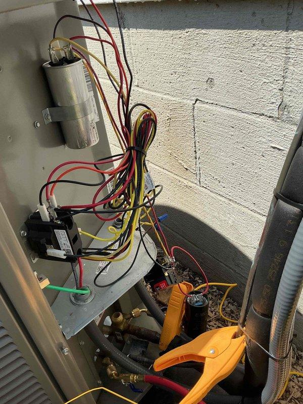 Responded to no cooling complaint on recently installed air conditioning system that was also producing abnormal noises. Upon arrival, unit was shut down by customer. Performed diagnostic testing using refrigerant manifold gauges and clamp meter to assess system operation and electrical components. Inspected capacitor, contactor, and associated wiring connections within outdoor unit. Measured system temperatures and pressures, with readings indicating superheat and subcooling values of 240.1°F and 238°F respectively during testing phase. Verified proper electrical connections to capacitor and contactor assembly, checked for loose wiring or failed components that could cause unusual sounds. System evaluated under MVP membership, no additional treatment authorized at this time.