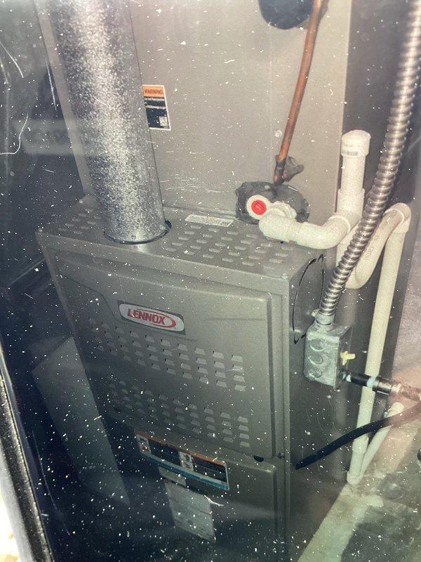 Completed MVP cooling maintenance visit on Lennox furnace system. Performed visual inspection of unit, control panel, electrical components, refrigerant lines, condensate drainage system, and gas connections. Documented system condition with photographs showing all major components including ductwork, PVC venting, copper refrigerant lines, and control board wiring operating within normal parameters.