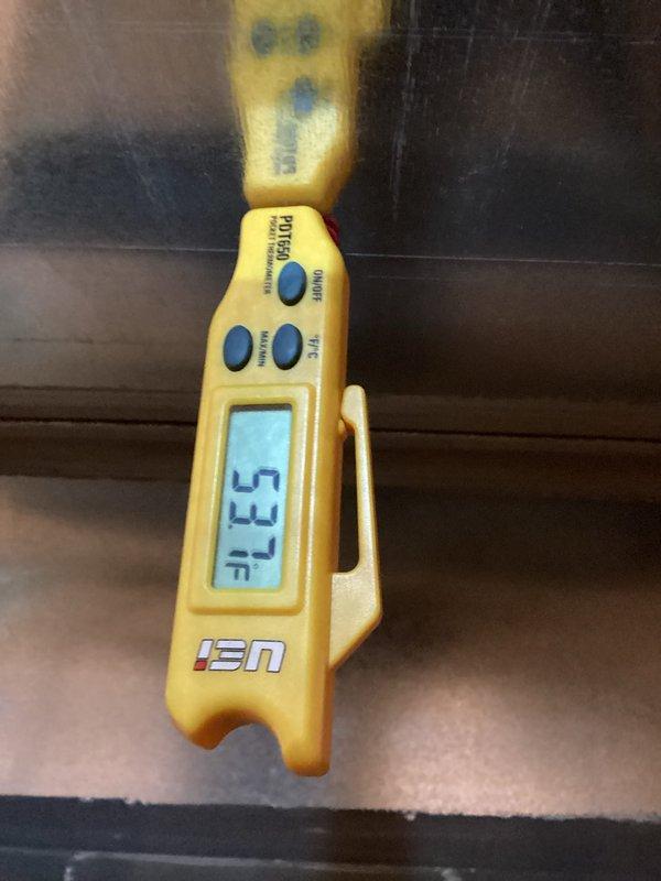 Completed MVP recurring cooling maintenance visit on 2-year-old system. Performed standard system inspection and diagnostics, recording temperature readings of 52.9°F at evaporator coil using infrared thermometer. Documented moderate dust and debris accumulation on condenser coil fins requiring attention at next service interval.