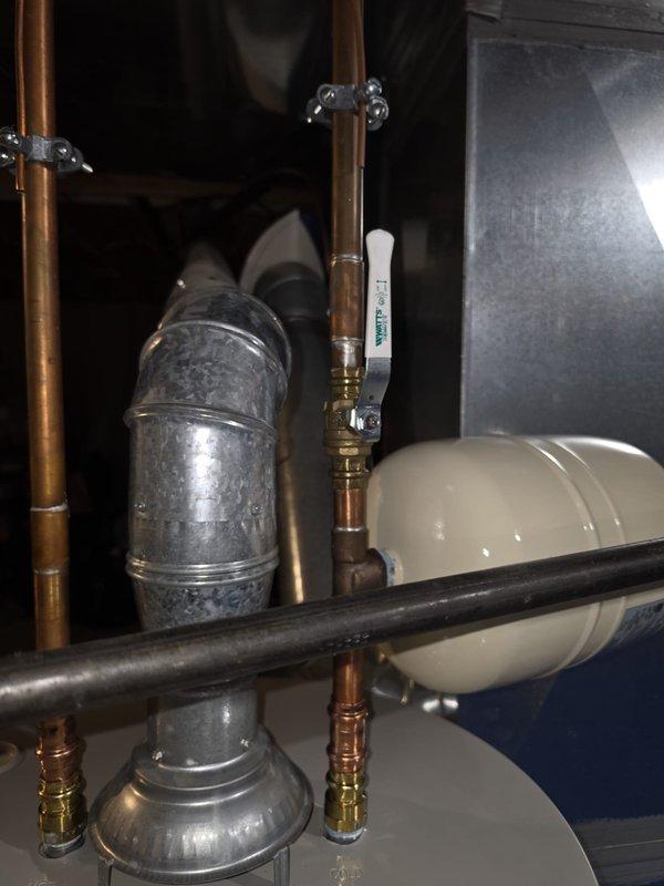 Removed existing water heater and installed new Bradford White 8-year warranty unit with complete system integration. Replaced thermal expansion tank to ensure proper pressure regulation and system safety. All existing plumbing connections, gas lines, temperature and pressure relief valve, and copper piping were verified to meet current code requirements upon completion of installation.