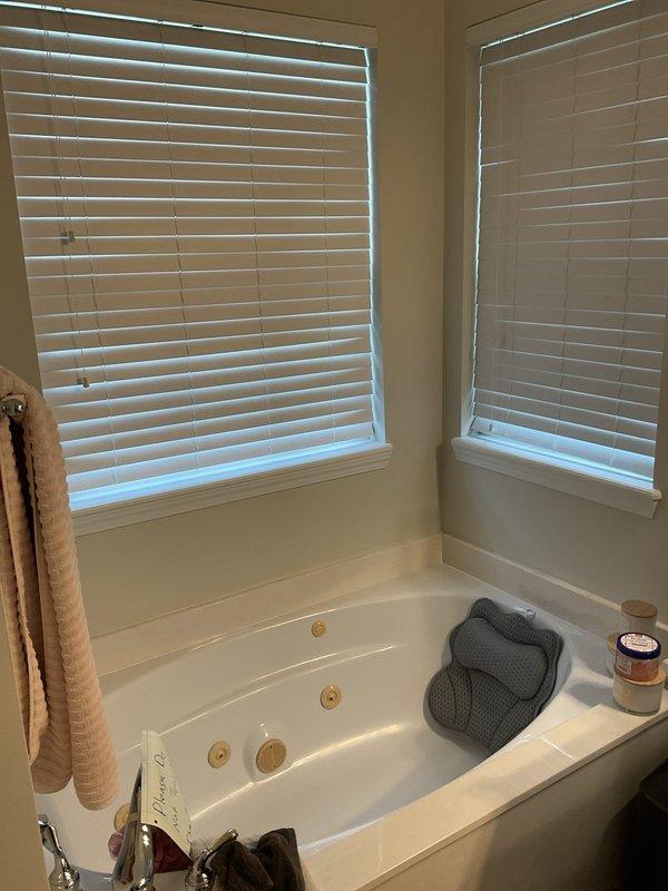 Conducted on-site assessment for existing corner-mounted jetted whirlpool bathtub replacement. Evaluated current installation including jet system, plumbing connections, and tub surround configuration. Identified water damage on ceiling above bathtub area indicating previous or ongoing moisture intrusion requiring attention during replacement process. Provided detailed estimate for removal of jetted tub and installation of standard bathtub, including assessment of necessary plumbing modifications, drain reconfiguration, and potential remediation work for water-damaged drywall. Documented existing conditions through photographic evidence for estimate preparation.