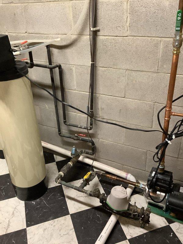 Conducted site evaluation for automatic water shut-off valve installation in home built circa 2002. Assessed existing plumbing infrastructure in utility room, including water softener system, pressure regulation equipment, and main water line configuration with copper and PVC piping. Provided product literature and manufacturer information for automatic shut-off valve options suitable for the existing plumbing setup. Discussed installation requirements, valve placement options at main water supply line, and integration with current water treatment system. No immediate plumbing issues identified during inspection.