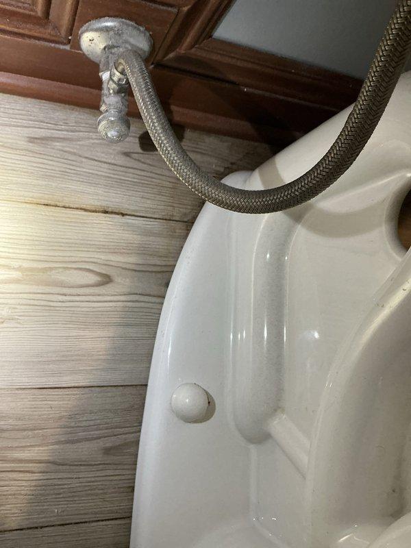 Responded to service call for toilet experiencing squealing noise and water leakage at the base. Upon inspection, identified faulty fill valve causing the squealing sound and compromised wax ring seal resulting in water seepage around the toilet base onto the wood flooring. Replaced the defective fill valve assembly and installed new wax ring seal, ensuring proper toilet mounting and secure connection to the flange. Reconnected the braided stainless steel supply line to the shut-off valve, tested system operation, and confirmed elimination of both the squealing noise and base leakage.