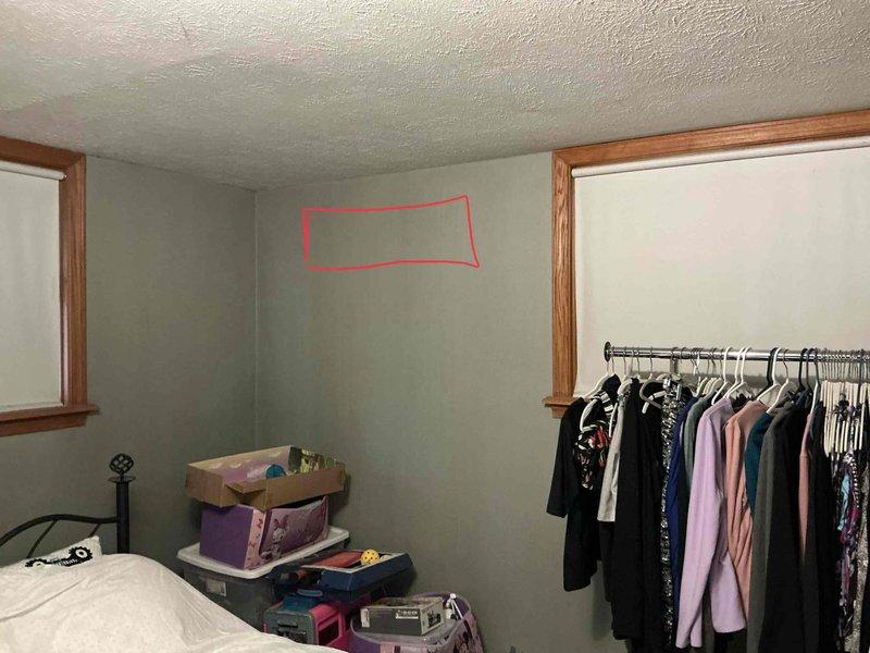 Conducted on-site assessment for mini split installation in lower level bedroom. Evaluated electrical panel capacity and circuit availability in basement utility area, documented existing infrastructure including panel location and wire routing. Assessed bedroom layout and identified optimal mounting location for indoor air handler unit on wall above storage area, ensuring proper clearance and airflow distribution for effective cooling coverage.