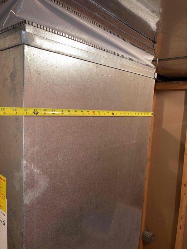 Performed assessment of 24-year-old air conditioning system found to be completely empty of refrigerant. Documented existing HVAC ductwork and electrical panel configuration with measurements and photographs for replacement estimate purposes.