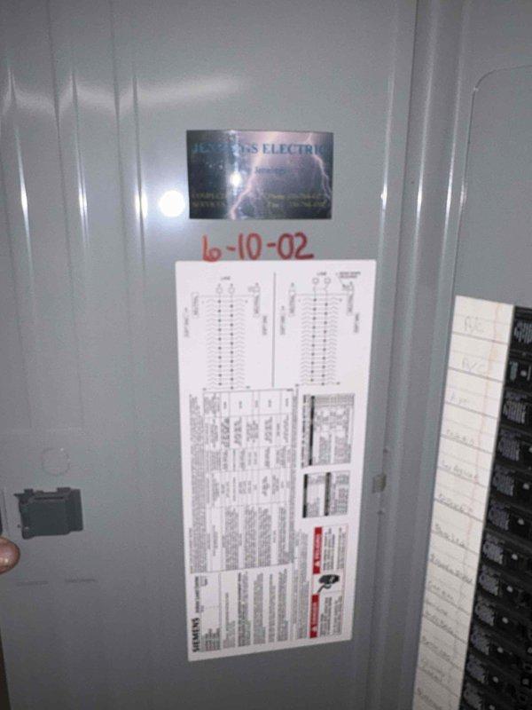 Performed assessment of 24-year-old air conditioning system found to be completely empty of refrigerant. Documented existing HVAC ductwork and electrical panel configuration with measurements and photographs for replacement estimate purposes.
