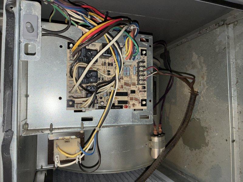 Responded to no-cooling complaint on residential split system. Upon arrival, found outdoor condenser unit heavily obstructed by overgrown vegetation restricting airflow to coil. Customer had already replaced filter and rinsed condenser prior to service call. Cleared vegetation from around unit perimeter and top discharge area to restore proper airflow and heat rejection. Inspected control board at air handler—all connections secure with no visual defects noted. Verified system operation after clearing obstruction; unit cycled properly with adequate airflow restored to condenser. Advised customer to maintain minimum 24-inch clearance around outdoor unit and monitor system performance over next cooling cycle.