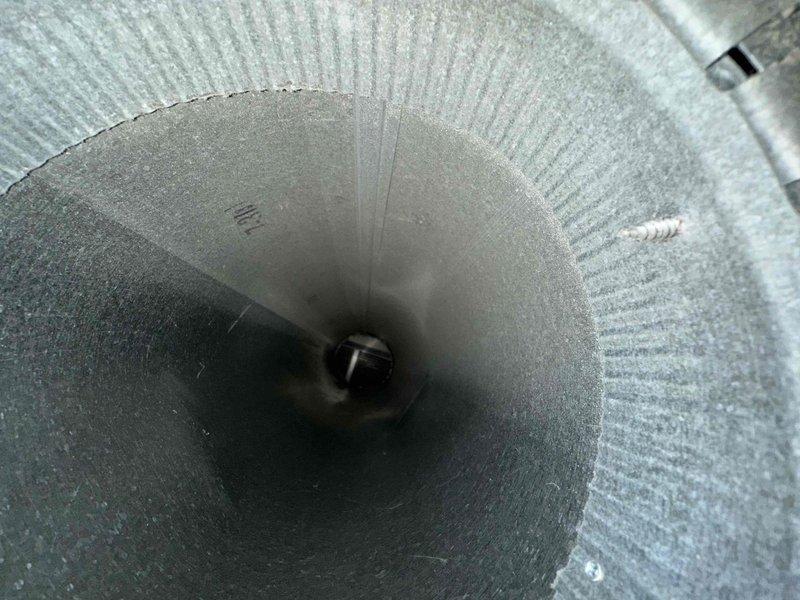 Completed comprehensive duct cleaning service for residential HVAC system. Thoroughly cleaned main rectangular supply duct showing significant accumulation of dust, debris, and contaminants on interior surfaces, walls, and ceiling. Cleaned flexible cylindrical branch ducts with ribbed construction, removing buildup and ensuring proper airflow throughout the ventilation system. All ductwork components inspected and cleaned to restore optimal air quality and system efficiency.