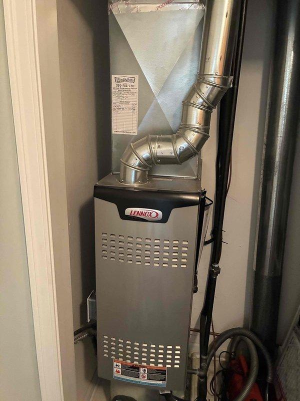 Performed comprehensive annual maintenance on residential Lennox air conditioning system. Inspected outdoor condensing unit, verified proper operation of compressor and fan motor, cleaned condenser coils, and checked refrigerant levels. Examined indoor air handler and evaporator coil assembly mounted above furnace unit, confirmed proper airflow through ductwork system. Tested electrical connections, verified amperage draws within manufacturer specifications, and inspected condensate drain line for proper drainage. System operating efficiently with no deficiencies noted at time of service.