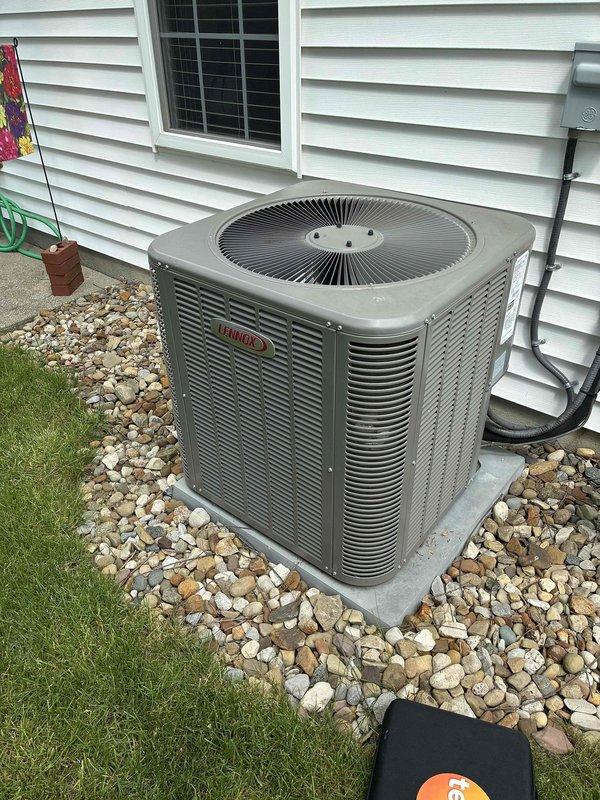 Performed comprehensive annual maintenance on residential Lennox air conditioning system. Inspected outdoor condensing unit, verified proper operation of compressor and fan motor, cleaned condenser coils, and checked refrigerant levels. Examined indoor air handler and evaporator coil assembly mounted above furnace unit, confirmed proper airflow through ductwork system. Tested electrical connections, verified amperage draws within manufacturer specifications, and inspected condensate drain line for proper drainage. System operating efficiently with no deficiencies noted at time of service.