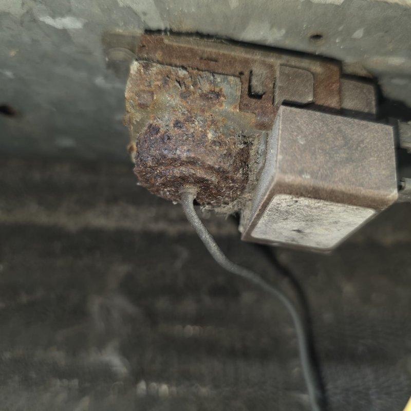 Responded to service call for 16-year-old General Electric heat pump unit experiencing frozen refrigerant lines and loss of cooling capacity. Upon inspection, identified unit utilizing R-22 refrigerant system with significant electrical connection corrosion and deterioration at outdoor unit. Documented equipment condition including heavily rusted electrical connector assembly showing evidence of prolonged moisture exposure, which likely contributed to system performance issues and potential electrical safety concerns requiring immediate attention.