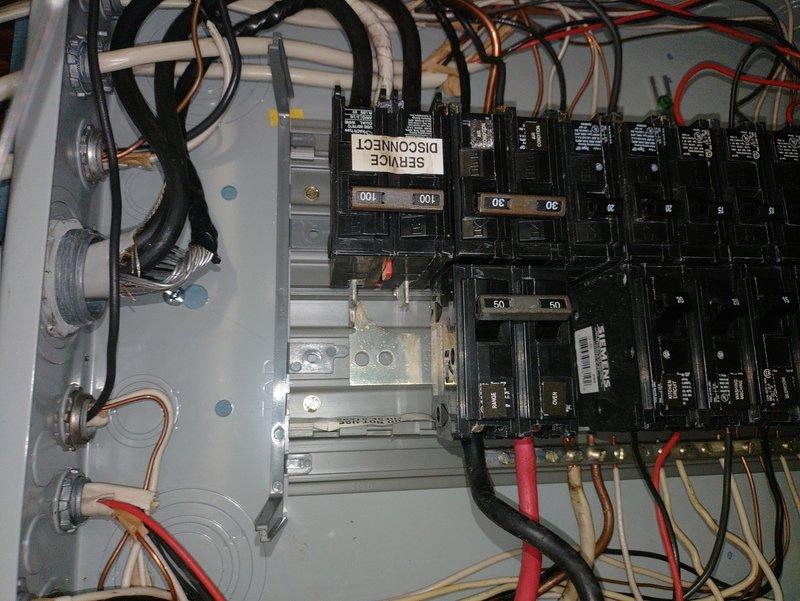Responded to intermittent partial power outages affecting approximately half the circuits in the residence. Upon inspection, discovered extensive water damage, rust, and corrosion throughout the main electrical panel enclosure, with heavy oxidation on interior surfaces and bus bars. The moisture intrusion had compromised panel integrity and created unsafe conditions causing the random power interruptions. Documented panel deterioration with photographs showing rust staining, peeling paint, corrosion around knockout holes, and possible mold growth. Recommended immediate panel replacement due to safety hazards and explained that the existing panel was beyond repair and posed fire and electrocution risks.