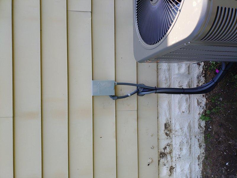 Installed dedicated AC circuit and power whip for outdoor condensing unit. Ran electrical wiring through attic space to exterior wall location, securing copper conductors to structural framing per code requirements. Terminated circuit at exterior disconnect and connected power supply to AC unit positioned on concrete pad. Verified proper voltage, tested circuit operation, and confirmed unit functionality upon energization.