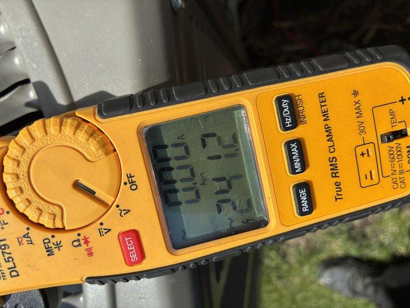 Completed scheduled preventive maintenance on a 5-year-old air conditioning system. Performed comprehensive system inspection including electrical measurements using clamp meter to verify proper amperage draw and voltage levels. Accessed interior components by removing top panel, inspected all wiring connections, capacitor, and motor housing for signs of wear or damage. All electrical connections were secure with proper wire routing observed. System components showed normal operational wear consistent with age, with some accumulated dust and surface grime noted on interior surfaces. Unit operating within normal parameters with no immediate repairs required.