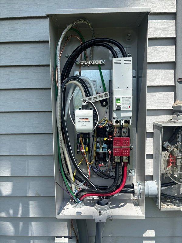 Completed installation of 26 kW Generac generator system with 50 feet of gas piping run from existing utility connections. Installed Generac automatic transfer switch in exterior-mounted electrical panel with proper integration to main service panel, including all necessary circuit breaker connections and control wiring. Coordinated installation to accommodate AEP power company disconnect requirements, ensuring proper clearances and accessibility for utility connections. All electrical connections completed per manufacturer specifications and local code requirements, with system tested and operational upon completion.