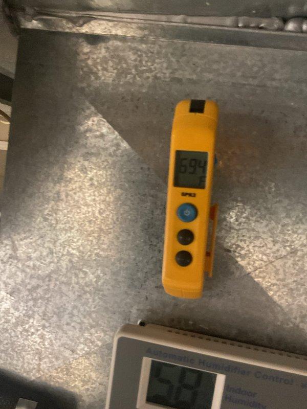 Completed MVP cooling maintenance visit. Inspected and tested electrical components including dual-element time-delay fuses (Tri-onic TR35R, 35A, 250V) mounted on copper bus bars, noting oxidation present on connections. Performed system diagnostics using digital measuring instruments to verify operational parameters and system performance.