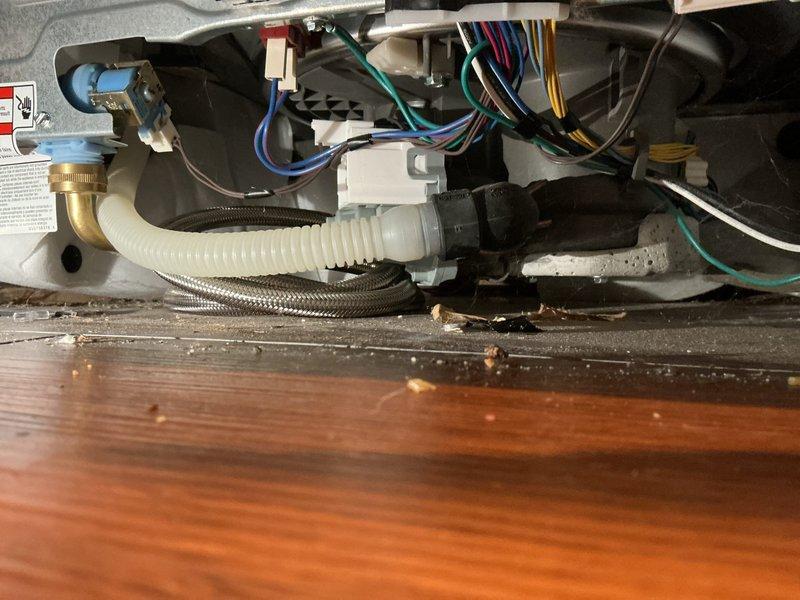 Responded to service call for inspection of main water shut-off valve, exterior spigot, and dishwasher supply line connection under kitchen sink. Assessed seized shut-off valve with inoperable knob to prevent potential damage from forced operation. Inspected dishwasher supply hose connection at sink base, garbage disposal unit, and associated PVC drain assembly. Examined appliance water supply lines including braided flex lines and valve connections. Documented existing plumbing configuration and provided recommendations for valve replacement and connection repairs to restore proper water control functionality.