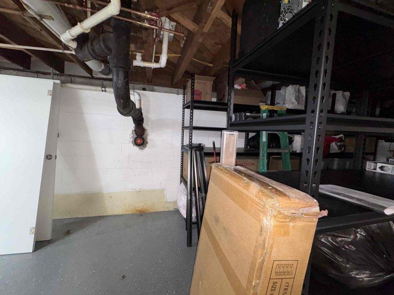 Completed comprehensive estimate for ductwork replacement in residential property. Assessed existing ductwork system in basement area containing asbestos materials requiring specialized removal by Erie prior to new installation. Documented current conditions including exposed ceiling joists, existing HVAC infrastructure, and storage areas that will need to be considered during ductwork replacement process.