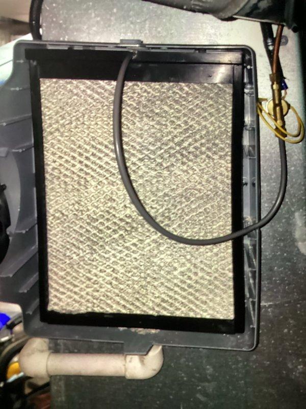 Completed MVP cooling maintenance visit. Inspected HVAC system including air filter, ductwork, and condensate drainage components. Filter examined and found to be in serviceable condition with proper airflow. Noted minor insulation damage on supply ductwork that may require future attention to maintain system efficiency. All accessible components photographed and system operating within normal parameters.