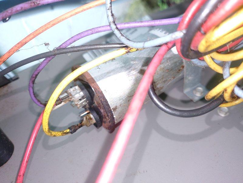 Responded to service call for non-operational central air conditioning system. Upon inspection, discovered severely corroded capacitor with rusted terminals and deteriorated wire connections, along with a separate electrical junction exhibiting extensive thermal damage, charring, and evidence of electrical arcing. Replaced failed capacitor and damaged wire connectors, cleaned all connection points, and secured all electrical terminations to manufacturer specifications. Tested system operation and verified proper amperage draw across all circuits. Unit restored to full operational status.